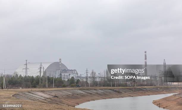 Panorama image of Chernobyl nuclear power plant with the new safe confinement structure and the river Pripyat. The New Safe Confinement structure was...