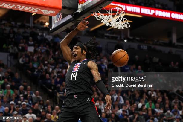 Terance Mann of the Los Angeles Clippers dunks the ball against the Minnesota Timberwolves in the fourth quarter during a Play-In Tournament game at...
