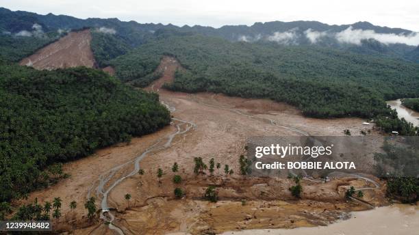 An aerial view shows the scene of a landslide which hit the village of Kantagnos in Baybay town, Leyte province on April 13 following heavy rains...