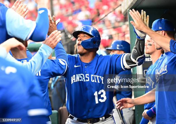 Kansas City Royals catcher Salvador Perez is congratulated by teammates after hitting a solo home run in the second inning during a Major League...