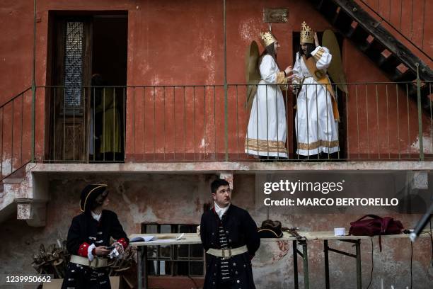 People wait to take part in the traditional popular and baroque funeral Easter rite known as the "Mortorio Pasquale" procession, on April 12, 2022 in...