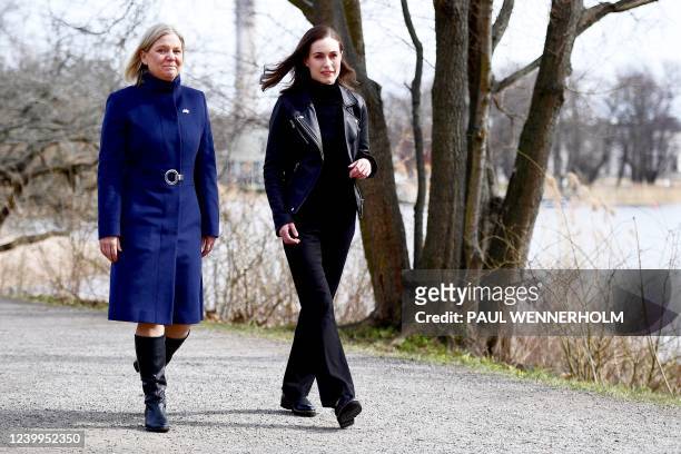 Swedish Prime Minister Magdalena Andersson and Finnish Prime Minister Sanna Marin walk prior to a meeting on whether to seek NATO membership in...