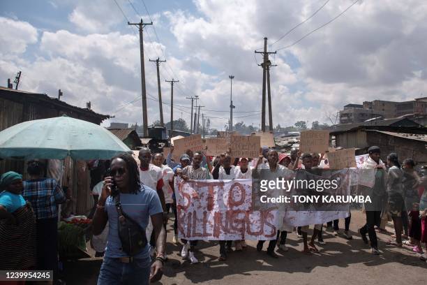 Kenyan activists protest against extra-judicial killings by police officers in Mathare slum, a hotspot for summary 'executions' of suspected...