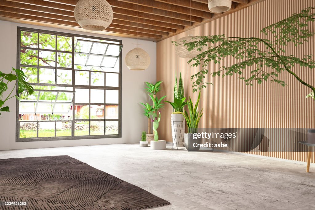 Unmöbliertes gemütliches Schlafzimmer mit Holzwand und Fenster