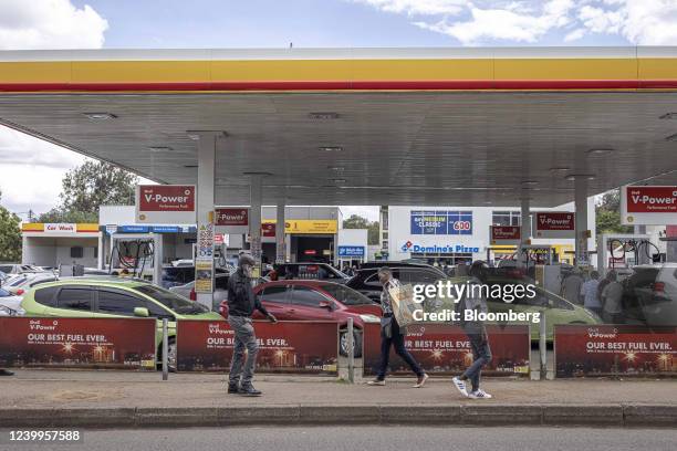 Automobiles on the forecourt of a Shell Plc gas station as drivers queue for fuel in Nairobi, Kenya, on Wednesday, April 13, 2022. Kenya agreed to...