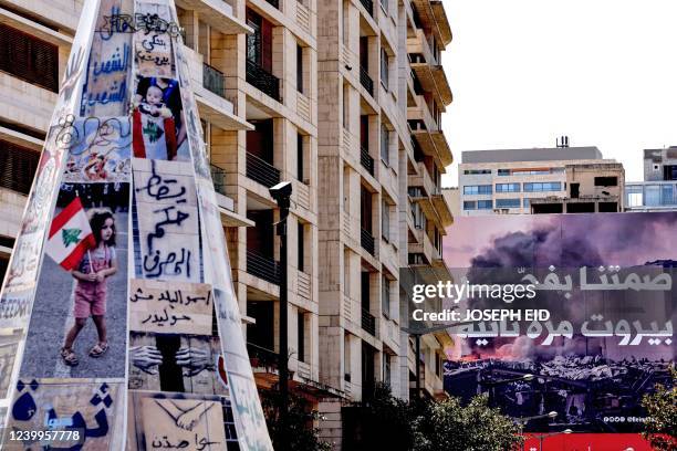 This picture taken in the centre of Lebanon's capital Beirut on April 13 shows a view of a conical fake-tree erected by protesters carrying...