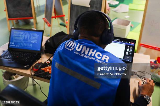 Cash enrolment centre opened by UNHCR for refugees from Ukraine who fled to Poland after Russian attack, at a at TAURON Arena Krakow. Krakow, Poland...