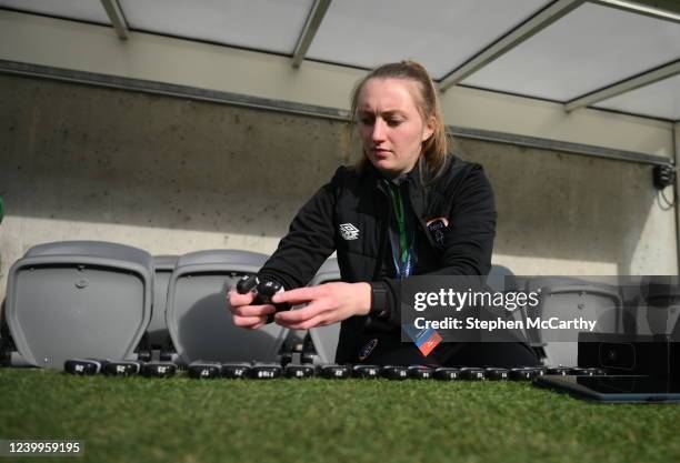 Gothenburg , Sweden - 12 April 2022; Republic of Ireland StatSports technician Niamh McDaid prepares players GPS units before the FIFA Women's World...