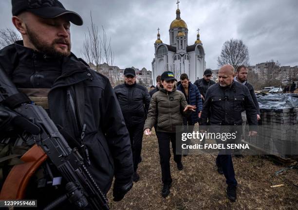 Graphic content / TOPSHOT - Ukraine's Prosecutor General Iryna Venediktova and Prosecutor of the International Criminal Court, Britain's Karim Khan ,...