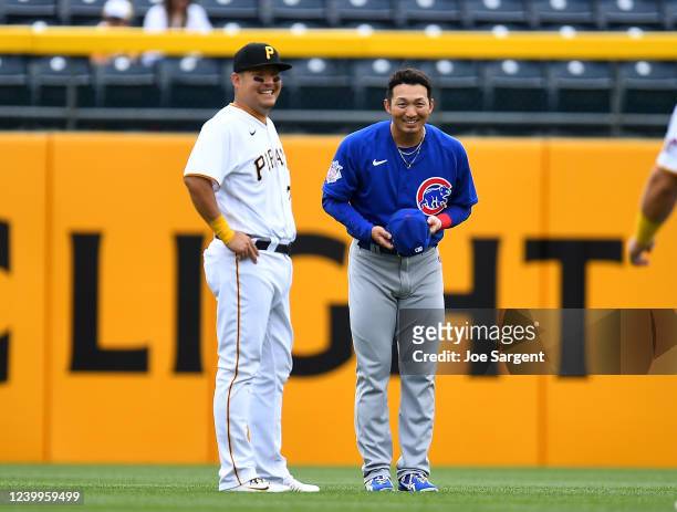 Yoshi Tsutsugo of the Pittsburgh Pirates and Seiya Suzuki of the Chicago Cubs talk prior to the game at PNC Park on April 13, 2022 in Pittsburgh,...