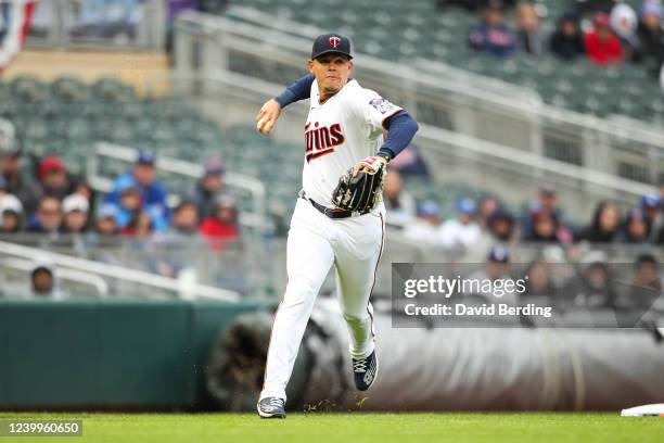 Gio Urshela of the Minnesota Twins commits a throwing error on a ball hit by Trea Turner of the Los Angeles Dodgers in the first inning of the game...