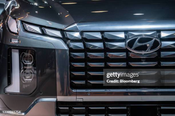 The redesigned grille and headlight of a 2023 Hyundai Palisade sports utility vehicle during the 2022 New York International Auto Show in New York,...