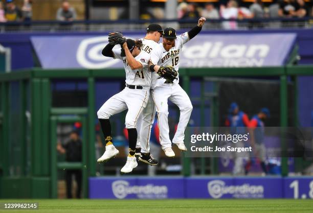 Jake Marisnick, Bryan Reynolds and Ben Gamel of the Pittsburgh Pirates celebrate after a 6-2 win over the Chicago Cubs at PNC Park on April 13, 2022...