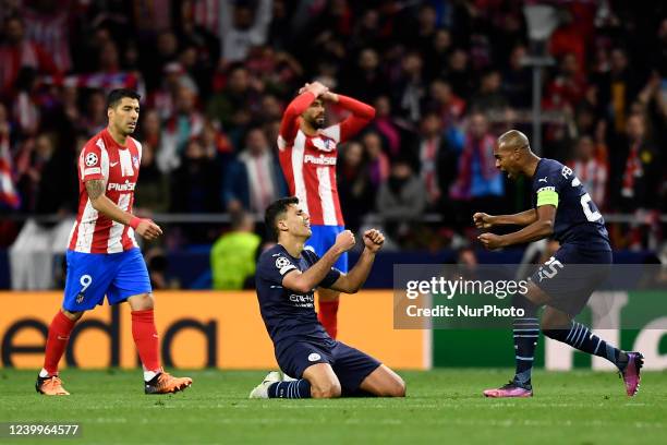 Rodri and Fernandinho of Manchester City celebrates victory and Luis Suarez of Atletico Madrid dejected after the UEFA Champions League Quarter Final...