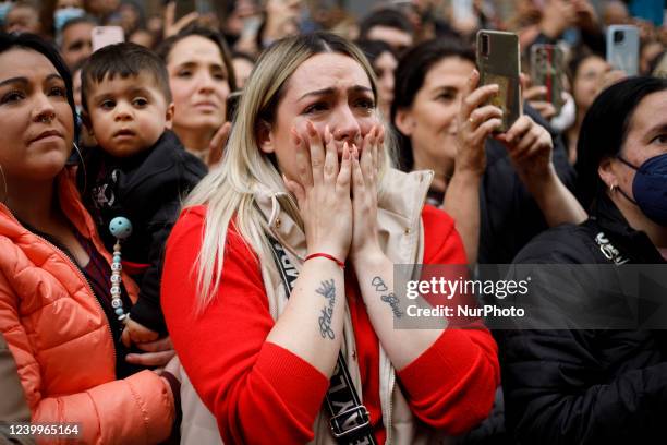 Faithful woman, with a tattoo that says Gipsy, cries as she sees the image of Maria Santisima del Sacromonte from the Cristo de los Gitanos...