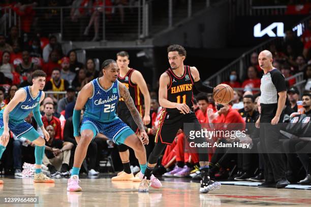 Cody Martin of the Charlotte Hornets plays defense on Trae Young of the Atlanta Hawks during the 2022 Play-In Tournament on April 13, 2022 at State...