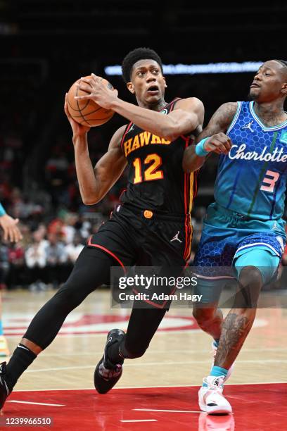 De'Andre Hunter of the Atlanta Hawks drives to the basket against the Charlotte Hornets during the 2022 Play-In Tournament on April 13, 2022 at State...