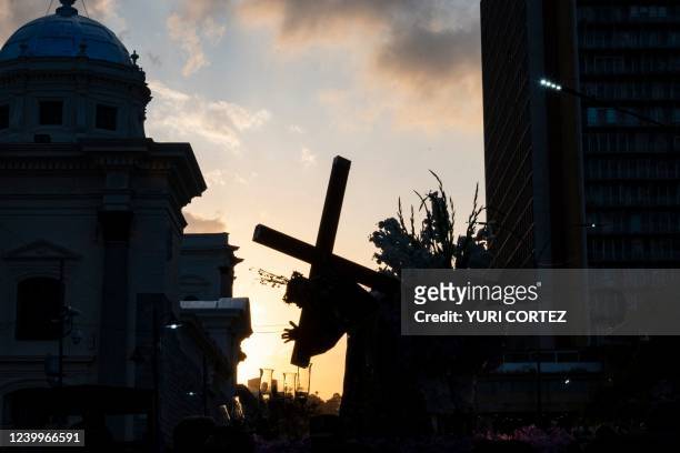 Catholic parishioners attend the traditional procession of the Nazareno de San Pablo as part of the celebration of Holy Week in Caracas on April 13,...