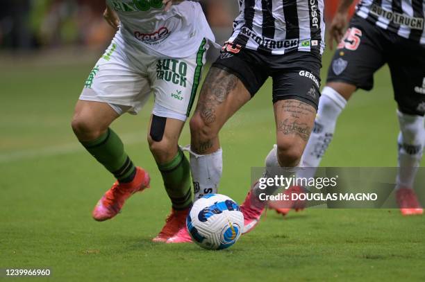 Brazil's America MG Felipe Azevedo and Brazil's Atletico Mineiro Chilean Eduardo Vargas vie for the ball during their Copa Libertadores group stage...