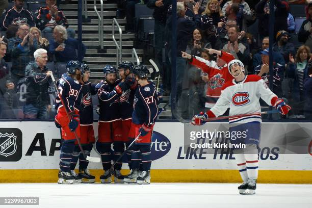 Emil Bemstrom of the Columbus Blue Jackets is congratulated by teammates after scoring a goal during the third period against the Montreal Canadiens...