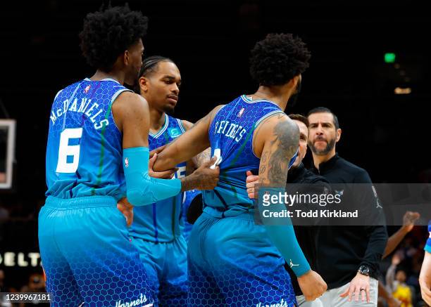 Miles Bridges of the Charlotte Hornets is restrained after a foul is called and he is ejected during the second half against the Atlanta Hawks at...