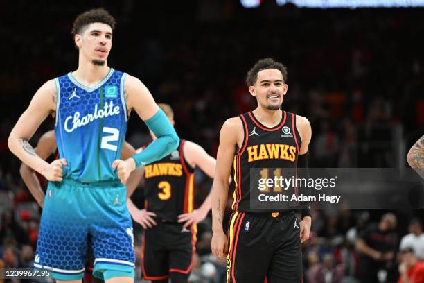 Trae Young of the Atlanta Hawks look on and smiles against the Charlotte Hornets during the 2022 Play-In Tournament on April 13, 2022 at State Farm...