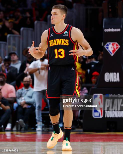 Bogdan Bogdanovic of the Atlanta Hawks reacts after making a three-point shot during the second half against the Charlotte Hornets at State Farm...