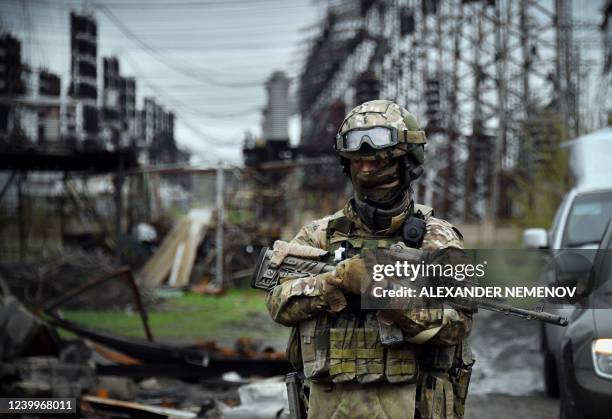 In this picture taken on April 13 a Russian soldier stands guard at the Luhansk power plant in the town of Shchastya. *EDITOR'S NOTE: This picture...