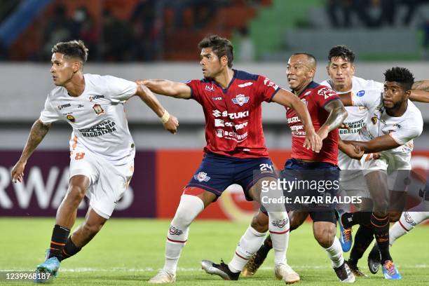 Peru's Ayacucho Eric Barrios and Jorge Toledo vie with Bolivia's Jorge Wilstermann Colombian Humberto Osorio and Edemir Rodriguez during their Copa...