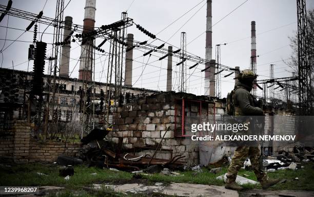 In this picture taken on April 13 a Russian soldier stands guard at the Luhansk power plant in the town of Shchastya. *EDITOR'S NOTE: This picture...