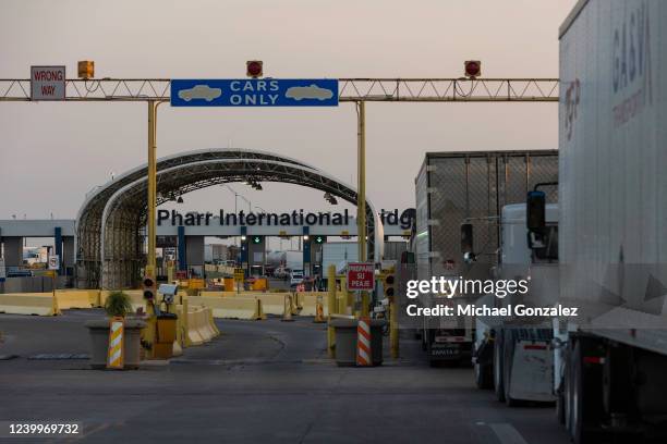 Several dozen commercial trucks wait to cross the Pharr-Reynosa International bridge on April 13, 2022 in Pharr, Texas. The bridge reopened to...