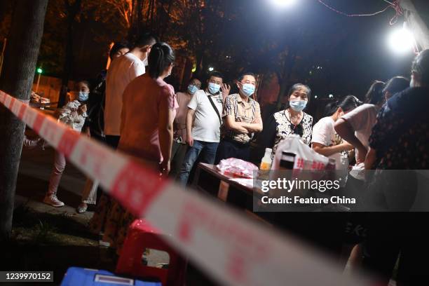 Residents have the Covid-19 test during an all-inclusive screening in Wuhan in central China's Hubei province Monday, April 11, 2022.