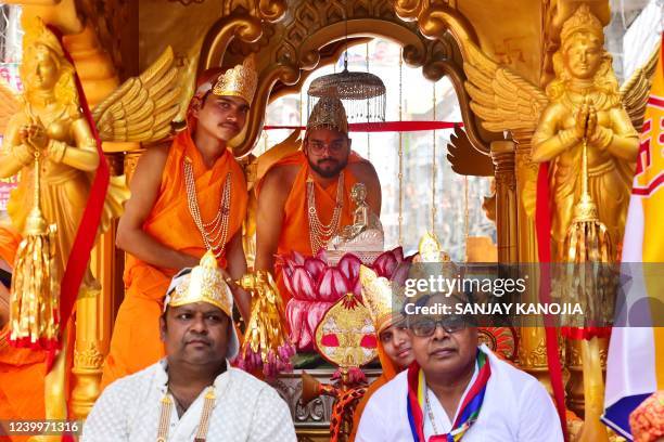 Priests of the Jain community offer prayers to Lord Mahavir during a religious procession on the occasion of 'Mahavir Jayanti' in Allahabad on April...