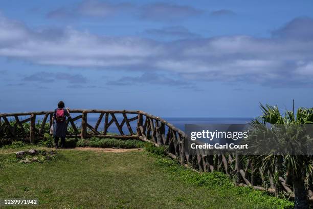 Woman looks out from the islands westernmost point on April 13, 2022 on Yonaguni, Japan. As Japans westernmost inhabited island, just 111 kilometres...