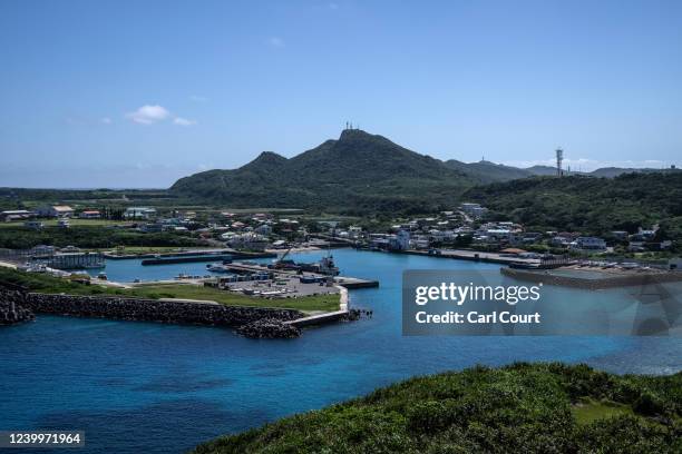 Radar towers stand atop hills overlooking the port town of Kubura on April 13, 2022 on Yonaguni, Japan. As Japans westernmost inhabited island, just...