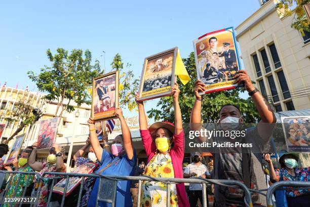 The royalist hold pictures of the Royal Monarch as they sing the national anthem and the royal anthem at 6:00 p.m. To show their allegiance to the...