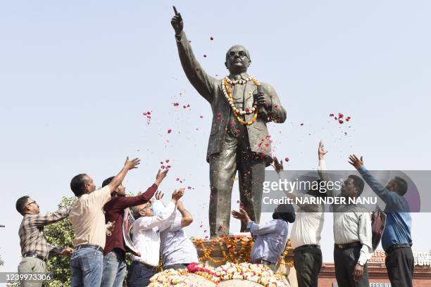 Members of All India PSB SC/ST Employees Welfare Council, pay tribute to a statue of social reformer B. R. Ambedkar on the occasion of his birth...