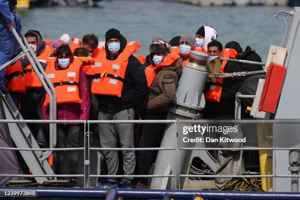 Migrants arrive at Dover port after being picked up in the channel by the Border Force on April 14, 2022 in Dover, England. The UK government...