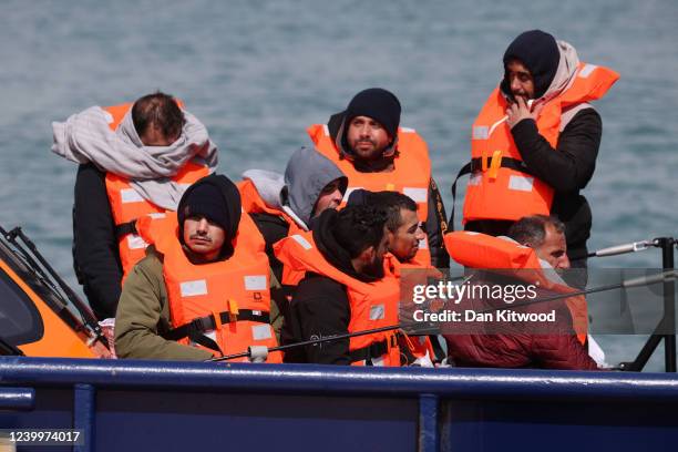 Migrants arrive at Dover port after being picked up in the channel by the Border Force on April 14, 2022 in Dover, England. The UK government...