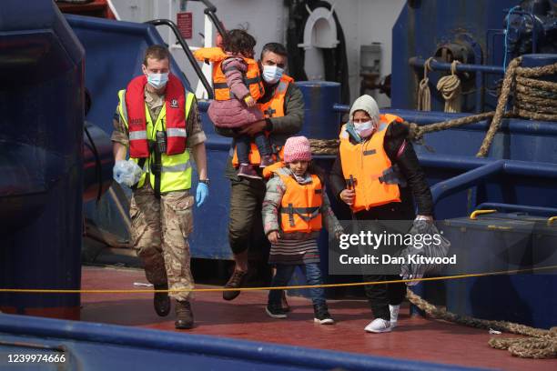 Migrants arrive at Dover port after being picked up in the channel by the Border Force on April 14, 2022 in Dover, England. The UK government...