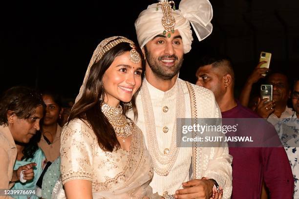 Bollywood actors Ranbir Kapoor and Alia Bhatt pose for pictures during their wedding ceremony in Mumbai on April 14, 2022.