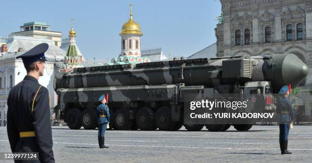 Russian Topol-M intercontinental ballistic misiles drive through Red Square during the Victory Day parade in Moscow on May 9, 2010. Troops from four...