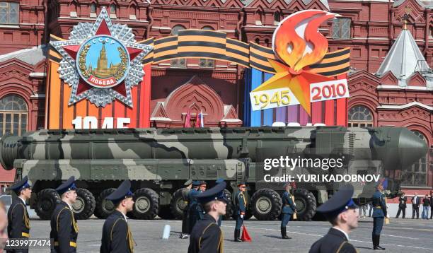 Russian Topol-M intercontinental ballistic misiles drive through Red Square during the Victory Day parade in Moscow on May 9, 2010. Troops from four...