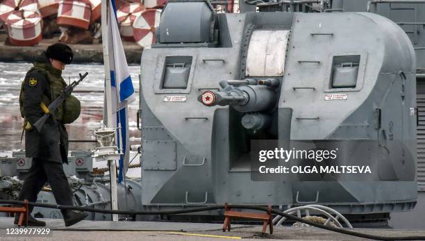 Russian serviceman guards the Russian Navy destroyer "Bespokoinyi", a museum ship set at the Patriot Park in Kronstadt, outside Saint Petersburg, on...