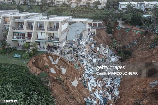 This aerial view shows the destruction at Umdloti beach north of Durban, on April 14, 2022. - Victims of South Africa's deadliest storm on record...