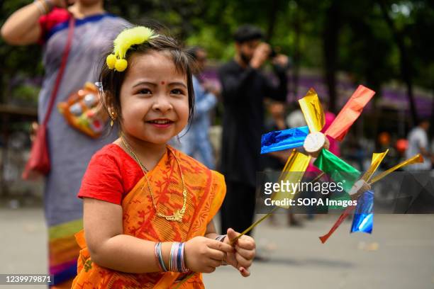 Kid takes part during the celebration the first day of the Bengali New Year. Bangladeshi people participate in a colorful parade to celebrate the...