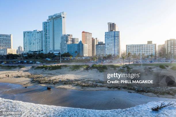 This aerial view shows debries at North Beach in Durban, on April 14, 2022. - Victims of South Africa's deadliest storm on record scrambled to get...