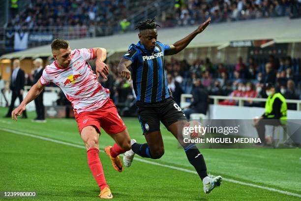 Atalanta's Colombian forward Duvan Zapata outflanks RB Leipzig's Hungarian defender Willi Orban during the UEFA Europa League quarter-final,...