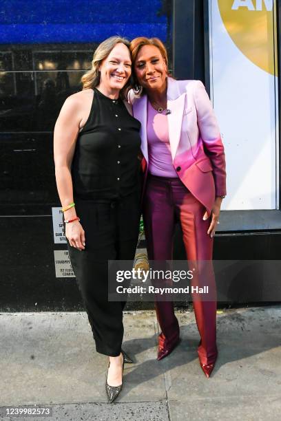 Amber Laign and Robin Roberts celebrate Robin Roberts' 20th "GMA" anniversary outside "Good Morning America" on April 14, 2022 in New York City.