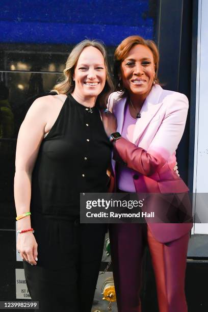 Amber Laign and Robin Roberts celebrate Robin Roberts' 20th "GMA" anniversary outside "Good Morning America" on April 14, 2022 in New York City.